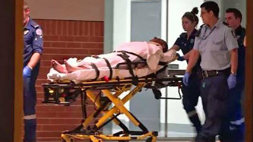 A man is wheeled into St George Hospital after the incident at Kogarah. Picture: 9 News
