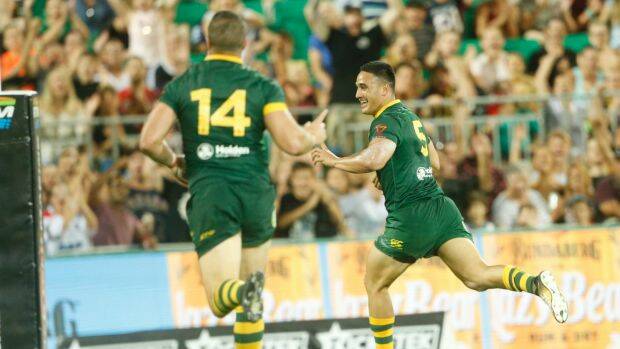 Unstoppable: Valentine Holmes races away for one of his record five tries against Samoa. Photo: AAP
