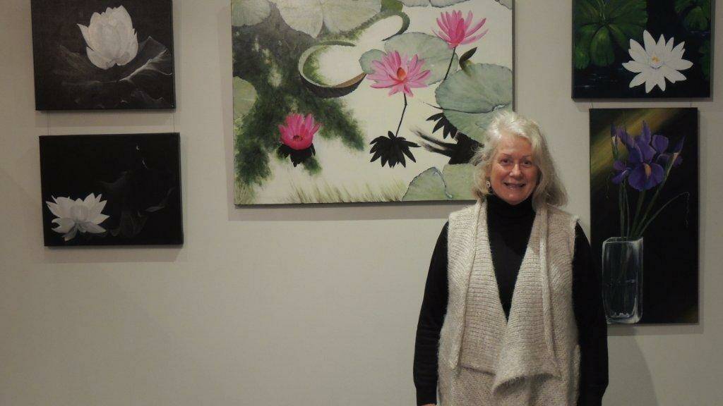 Flowering talent: Artist Maggie Bullock with some of her works in the new exhibition Bringing the outside in.