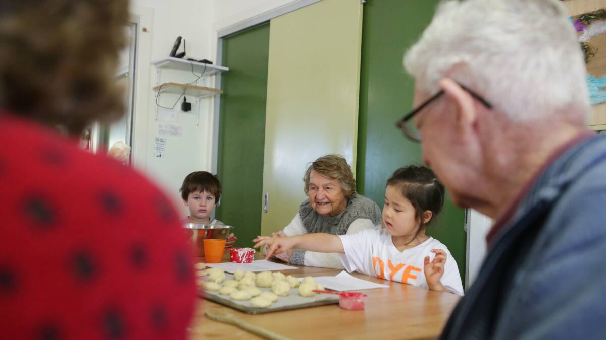 Recipe for living: Residents of Anglicare Chesalon at Jannali  teaching preschoolers the art of making scones: Picture: Chris Lane