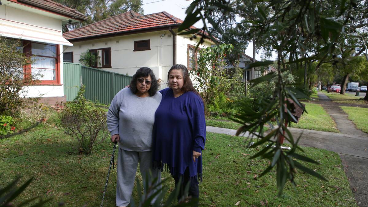 Disadvantaged by planning inconsistencies: Anita Gregor and her mother Ligia Amaya in front of their View Street home, with the houses to be demolished for the new townhouse development in the background. Picture: John Veage