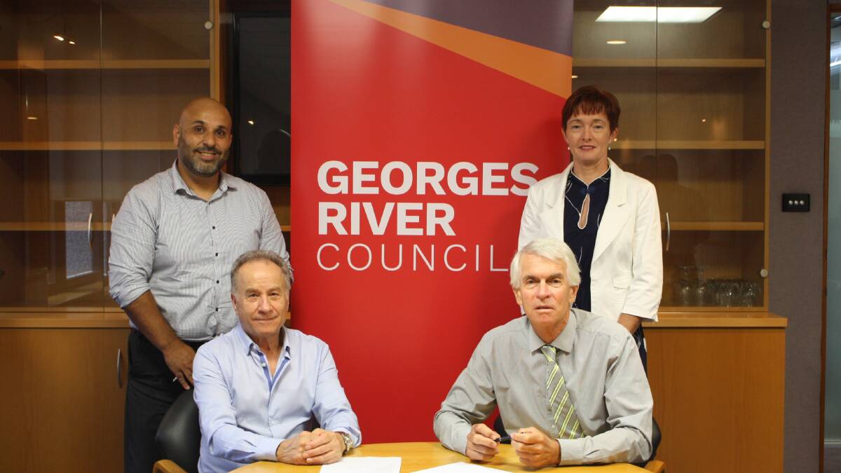 In agreement: (left to right) St George Business Chamber treasurer Tony Baddour, president Allan Zreik, Georges River Council administrator John Rayner and general manager Gail Connolly at the signing of the Memorandum of Agreement.