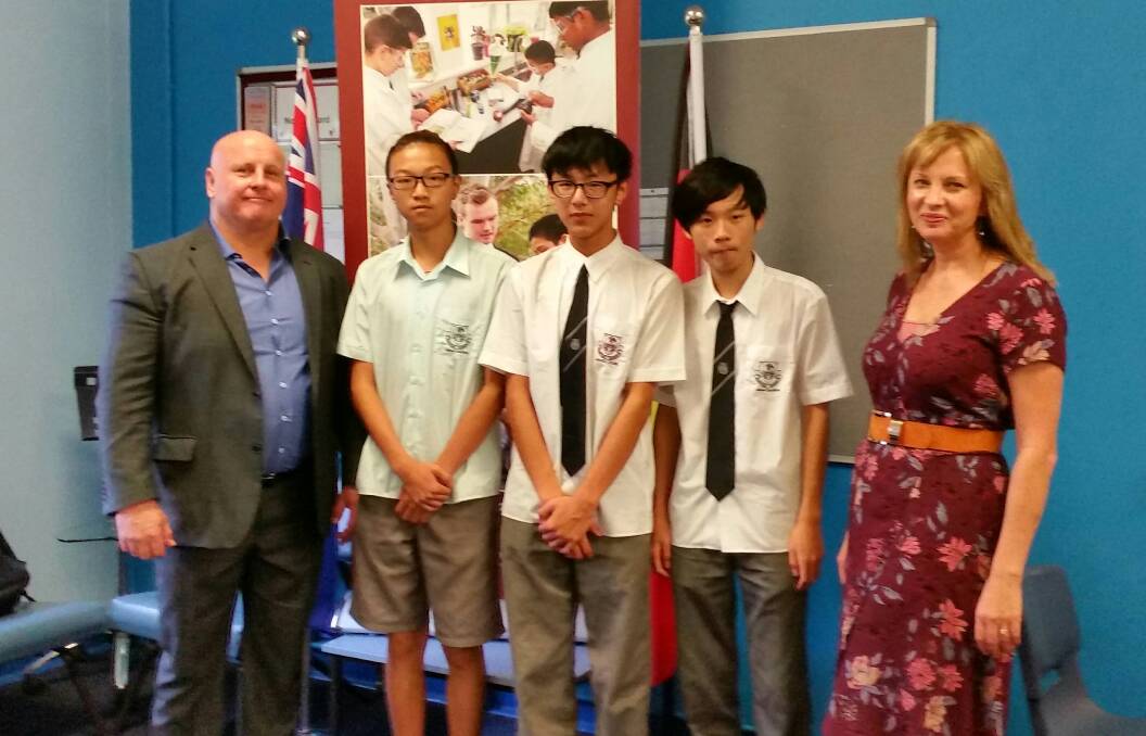 Getting up to speed: James Cook Technology High School principal, Mark Marciniak, some of the students, and Kogarah Community Services' Cathy Nisbet.