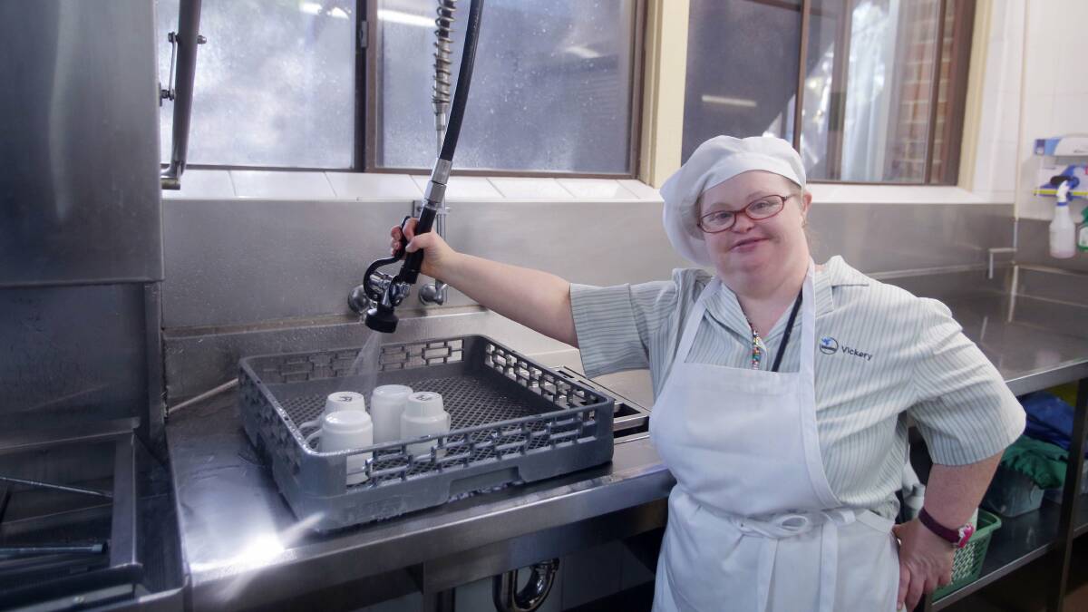 Milestone: Ali Leate at work in the kitchen at Frank Vickery Village, Sylvania. Picture: John Veage