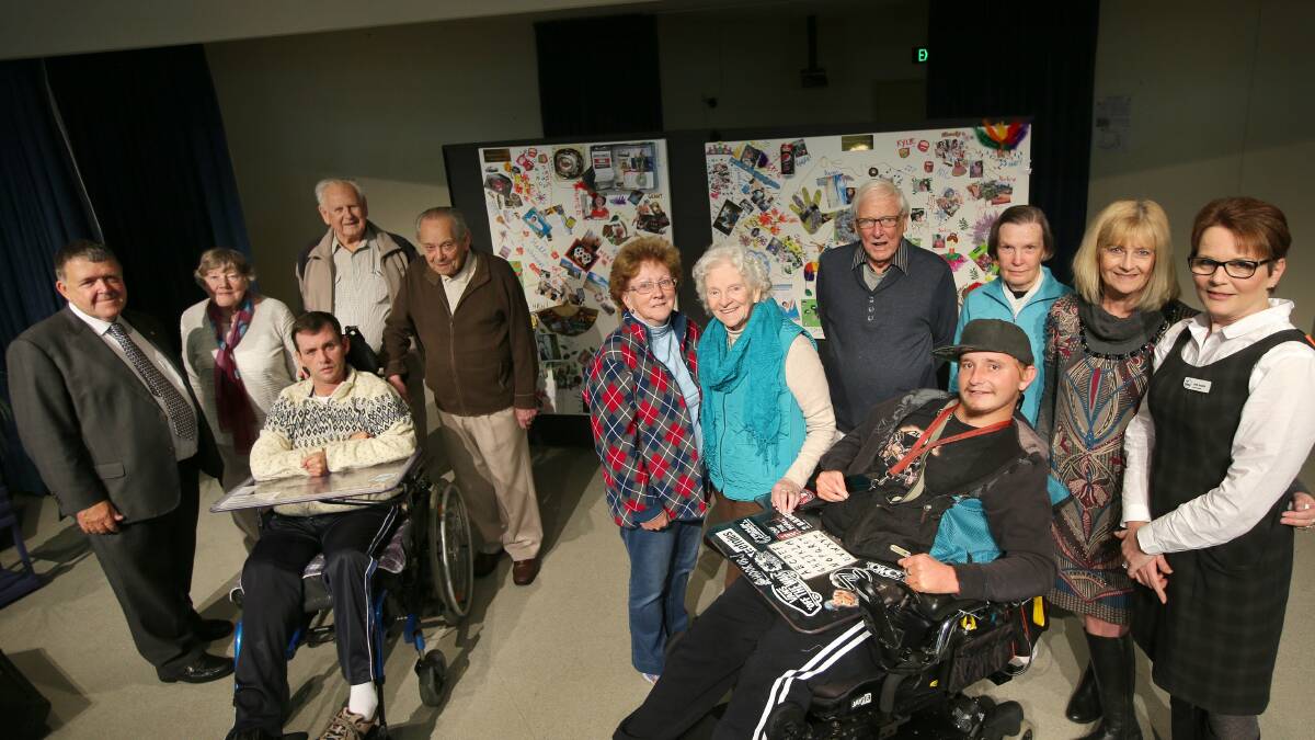 Artistic vision: Fank Vickery residents have painted a mural entitled Our Passion with the assistance of Wesley LifeSkills disability services clients Jamie and Grant, pictured with Wesley Mission's Reverend Keith Garner (left). Picture: John Veage