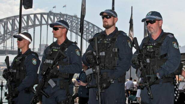 Public Order and Riot Squad officers with the Colt M4 assault rifles. Photo: Ben Rushton/AAP