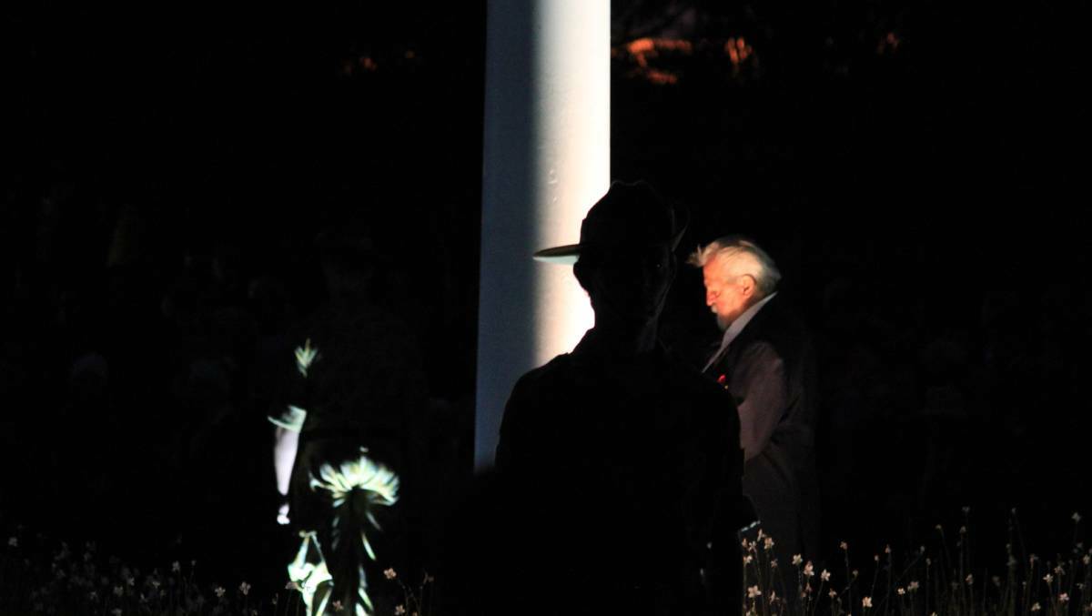 Silhouette of a soldier at the Rooty Hill service. Picture: Andrew McMurtry