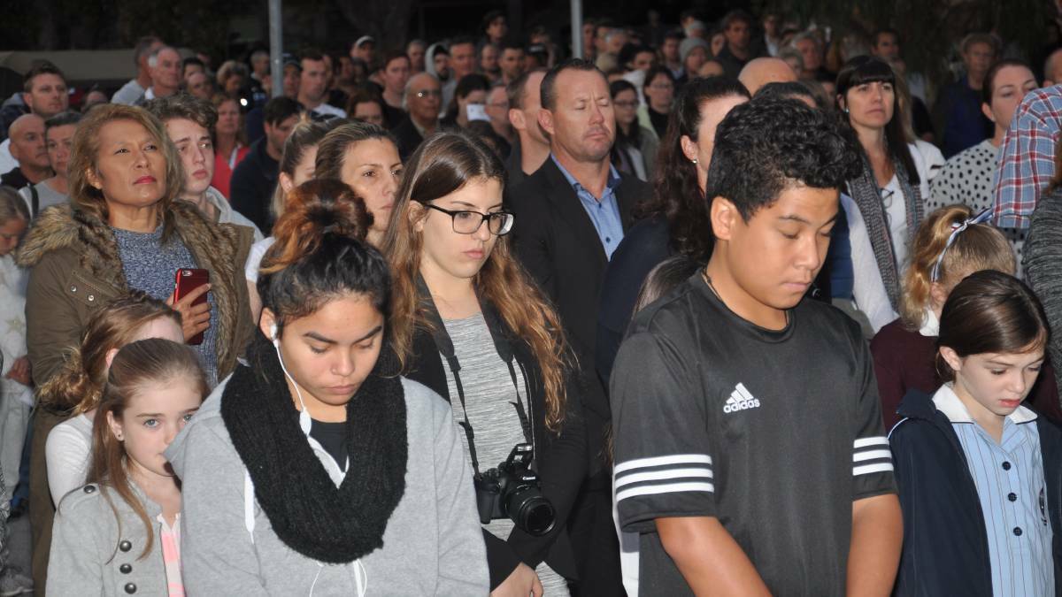 Respect: Some of the crowd at the dawn service at the war memorial on the edge of Seymour Shaw Park, Miranda. Picture: John Veage