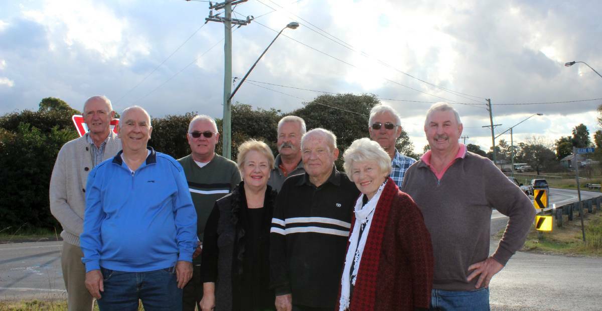 FINGERS CROSSED: Pitt Town Progress Association members at the intersection of Pitt Twon Road and Glebe Street, where the bypass will start. Picture: Conor Hickey