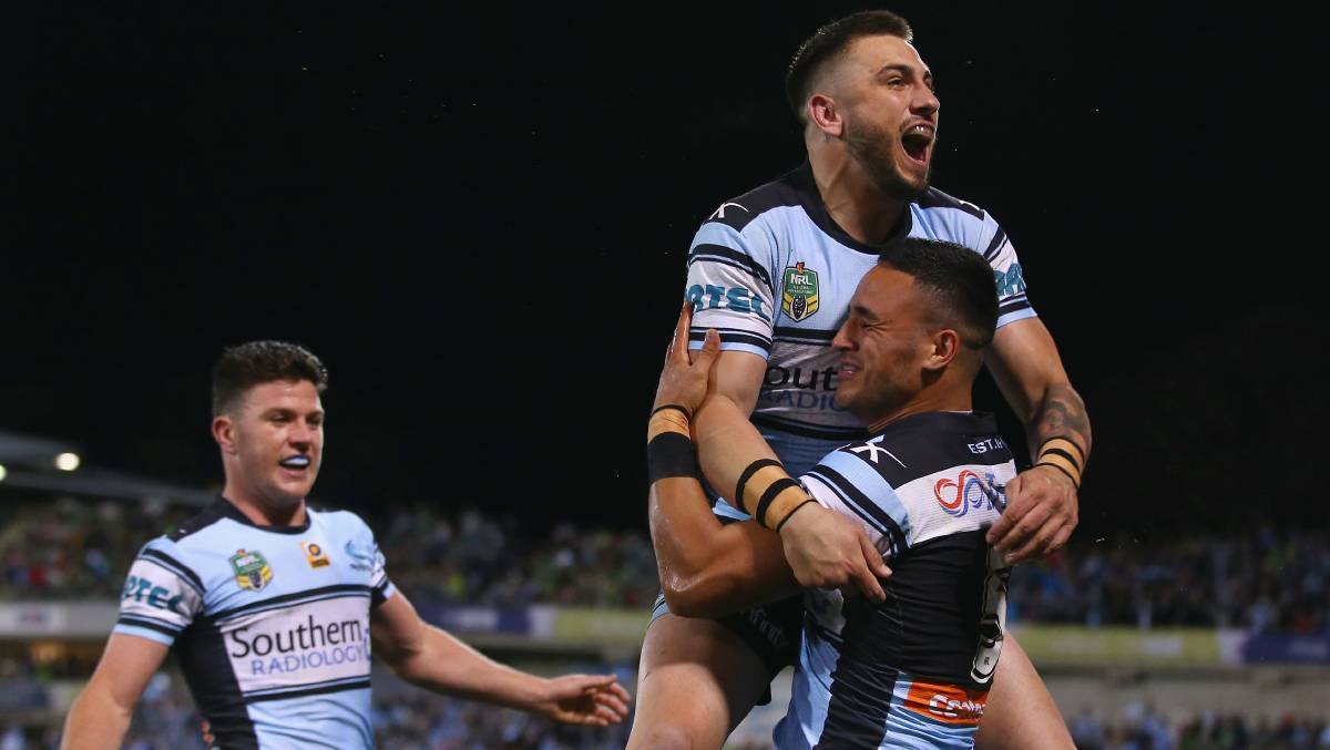 How sweet it is: Cronulla players celebrate one of the gutsiest wins in the club's history. Picture: Getty Images