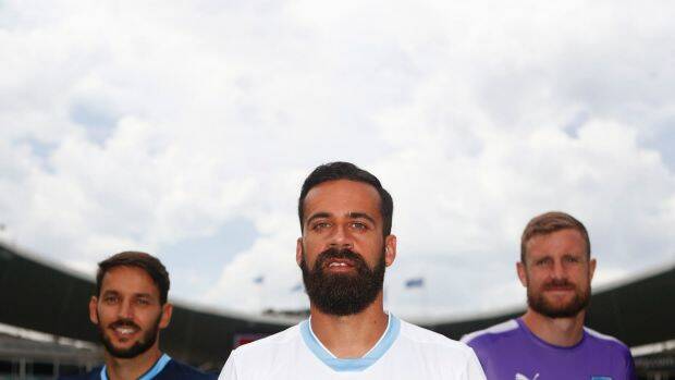 New look: Sydney FC captain Alex Brosque (centre) and team mates Milos Ninkovic and Andrew Redmayne in the club's new strip for the AFC Champions League. Photo: Daniel Munoz