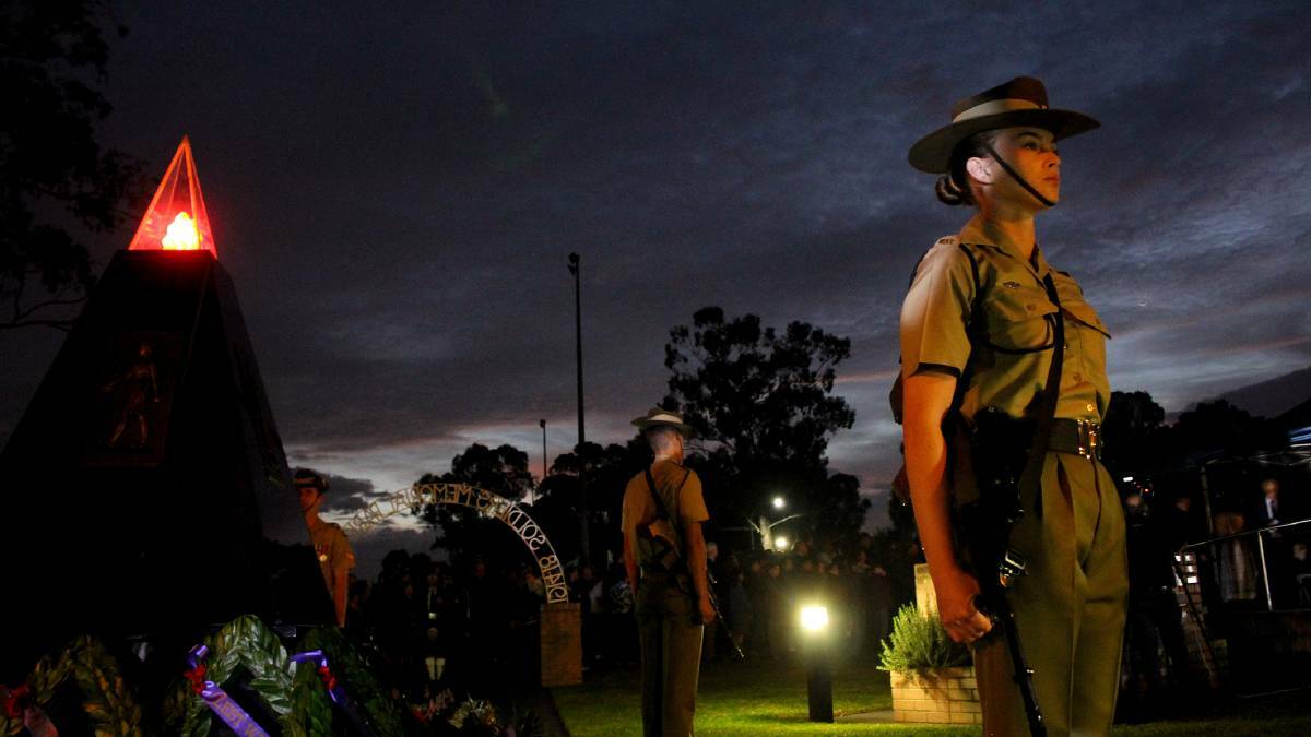 People pay their respects at the Ingleburn RSL Sub-branch Dawn Service. Picture: Jeff McGill