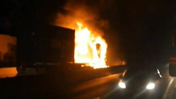 A truck that burst into flames on the M5 motorway on Friday morning, causing traffic delays. Photo: Supplied/Nine News