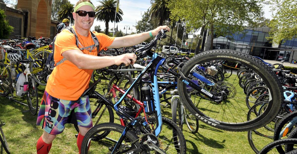 WAGGA'S Gus Willis finds his ride amid the multitude of participants' bikes after last year's rides.