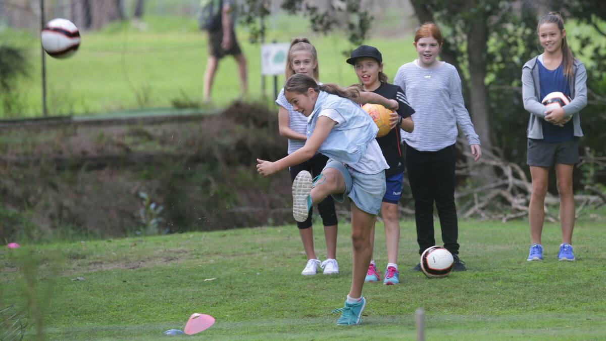 Teeing off: Soccer-golf is ideal for team training and kids' parties. The rules are the same as golf, with each kick counting as a shot. Picture: John Veage