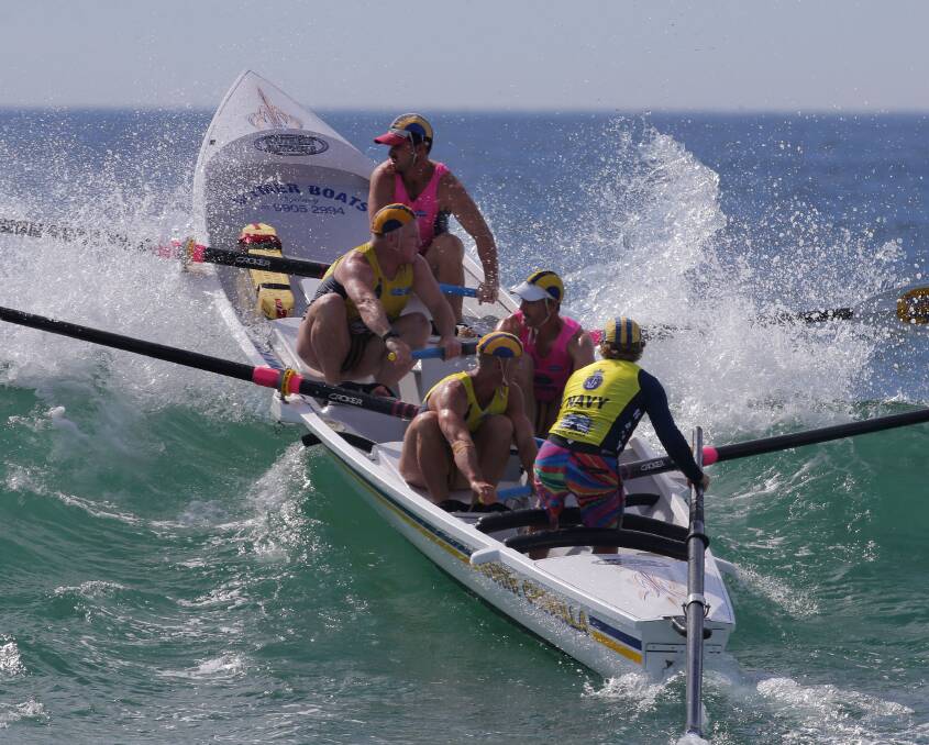Record numbers : A Nth Cronulla open men's boat crew takes to the water at the annual Christmas surf carnival,with over 110 crews taking part.Bulli won the open mens boat.Picture John Veage