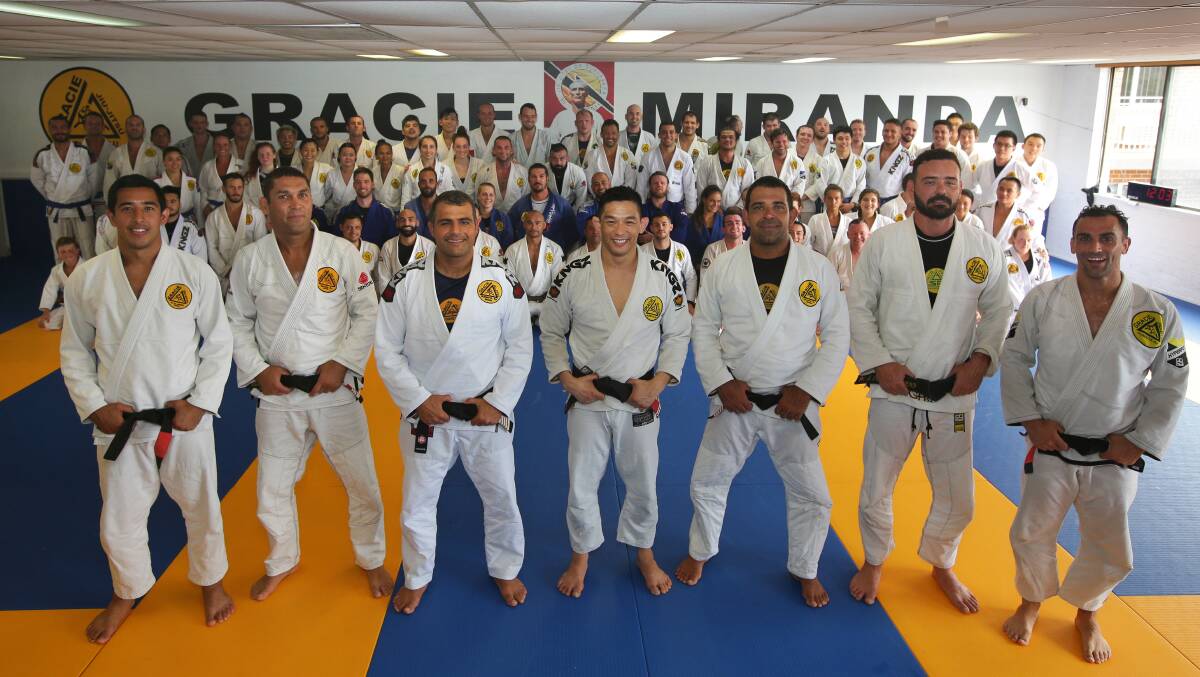 Opening: Owen Gee (centre) and blackbelts line up at the opening of the new Gracie Miranda school. Picture: John Veage