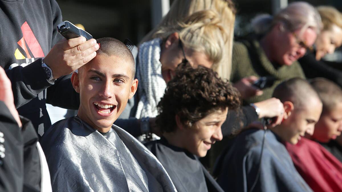 Shave #4 Ben: Cronulla school mates of Ben Savage shave their heads to show support. Pictures: John Veage