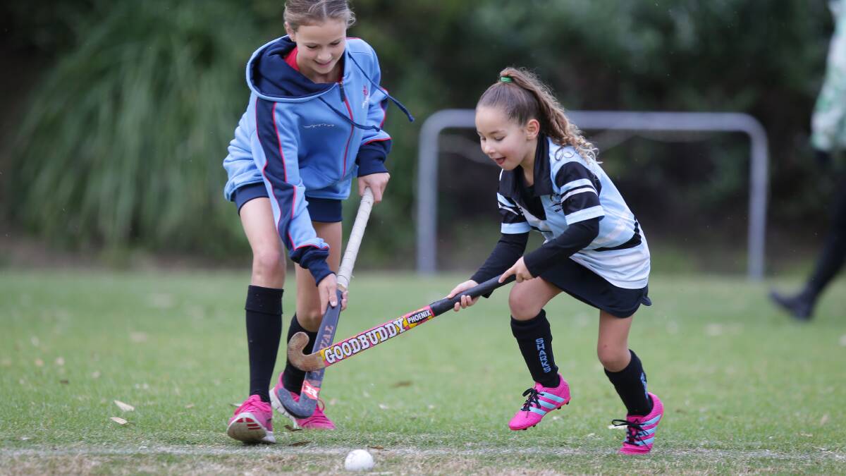 U15 NSW rep Miri Maroney takes on 6yr old "Whale Shark" Chelsea Grassmayr.Picture John Veage