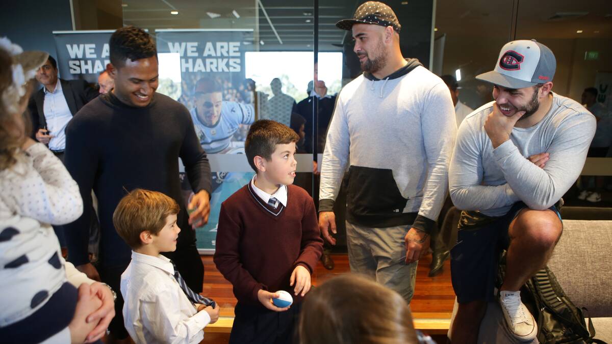 Team support: Sharks players, Ben Barba, Andrew Fifita and Wade Graham with Michael's family. Picture: John Veage