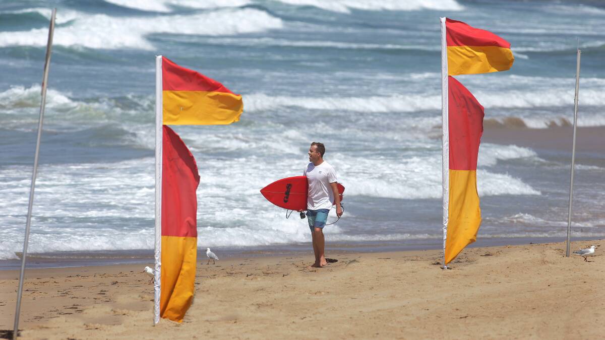 Season ends: Surf lifesavers have used the red and yellow flags for the last time this season. Picture: John Veage 