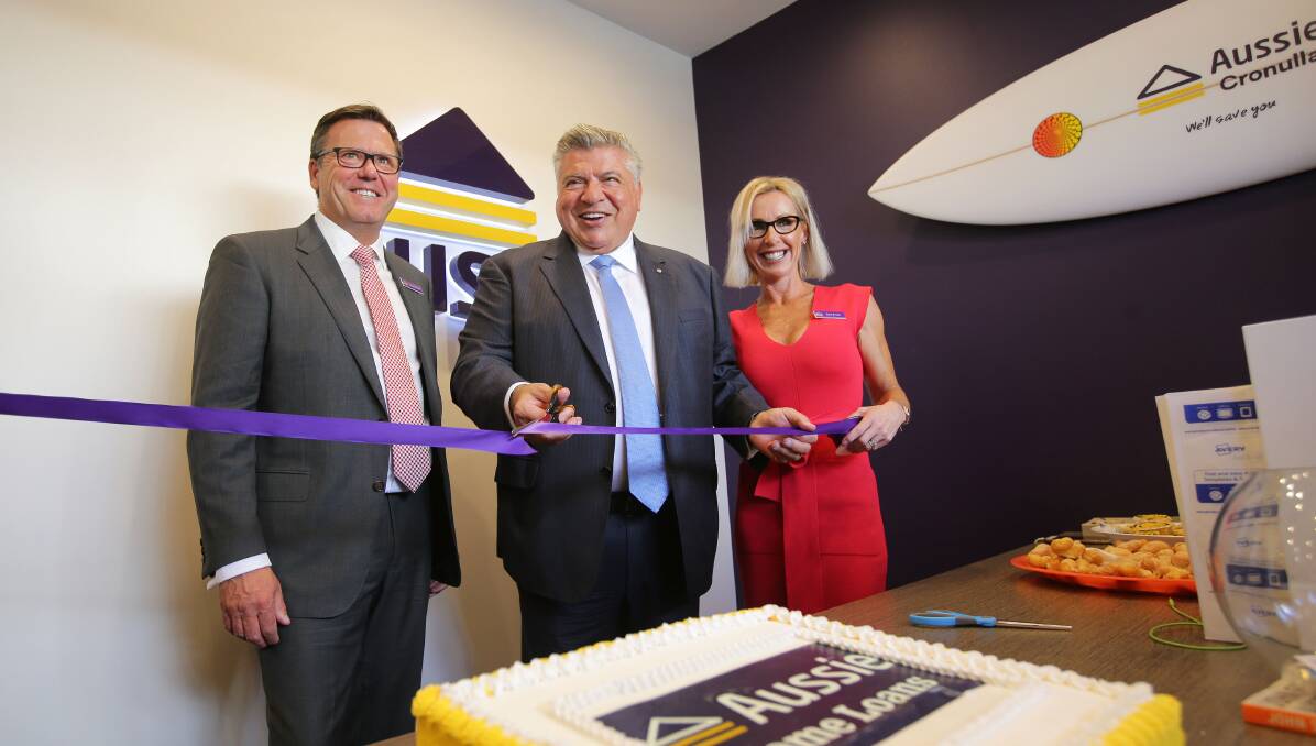 We'll save you: Chairman, John Symond, officially opened Vaughan and Fiona Fowler's Aussie Home Loans Cronulla store in Gerrale Street. Picture: John Veage