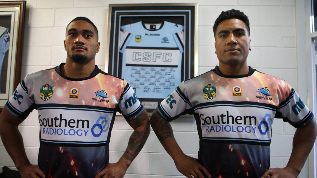 Battlefield: Sharks NRL players Ricky Leutele and Sosaia Feki model the Sharks strip for the upcoming clash with the Sydney Roosters.Picture John Veage