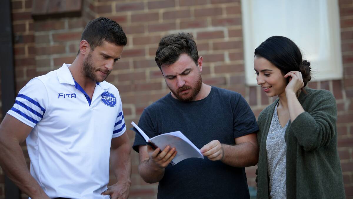 Direction: The cast of Chasing Comets, Dan Ewing and Kat Hoyos with director Jason Perini (centre). Picture: John Veage 