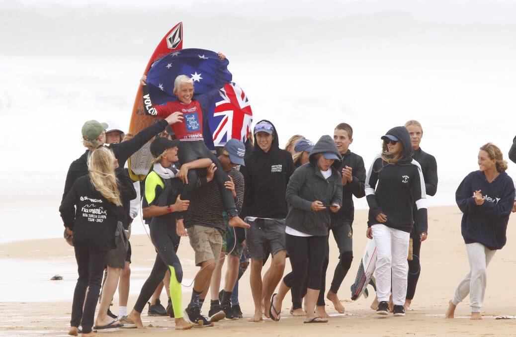 Standing tall: Jarvis Earle was chaired off the beach and crowned the Australian under-14s surfing champion at Culburra Beach last weekend. Picture: Steve Conti/Surfing NSW