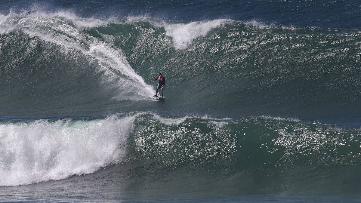 Skull or the Goblin catches a bomb at Wanda on his motorized surfboard on Saturday.Picture John Veage
