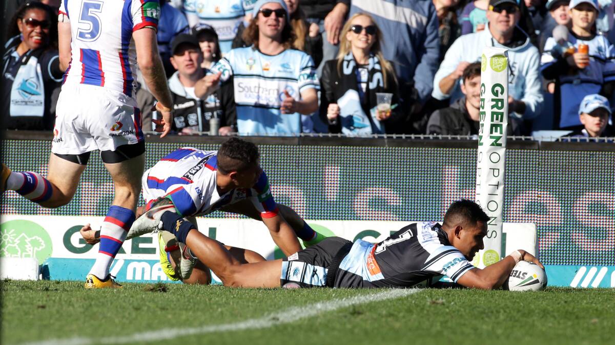 Try or no try?: Ben Barba had this effort controversially disallowed against Newcastle. Picture: John Veage