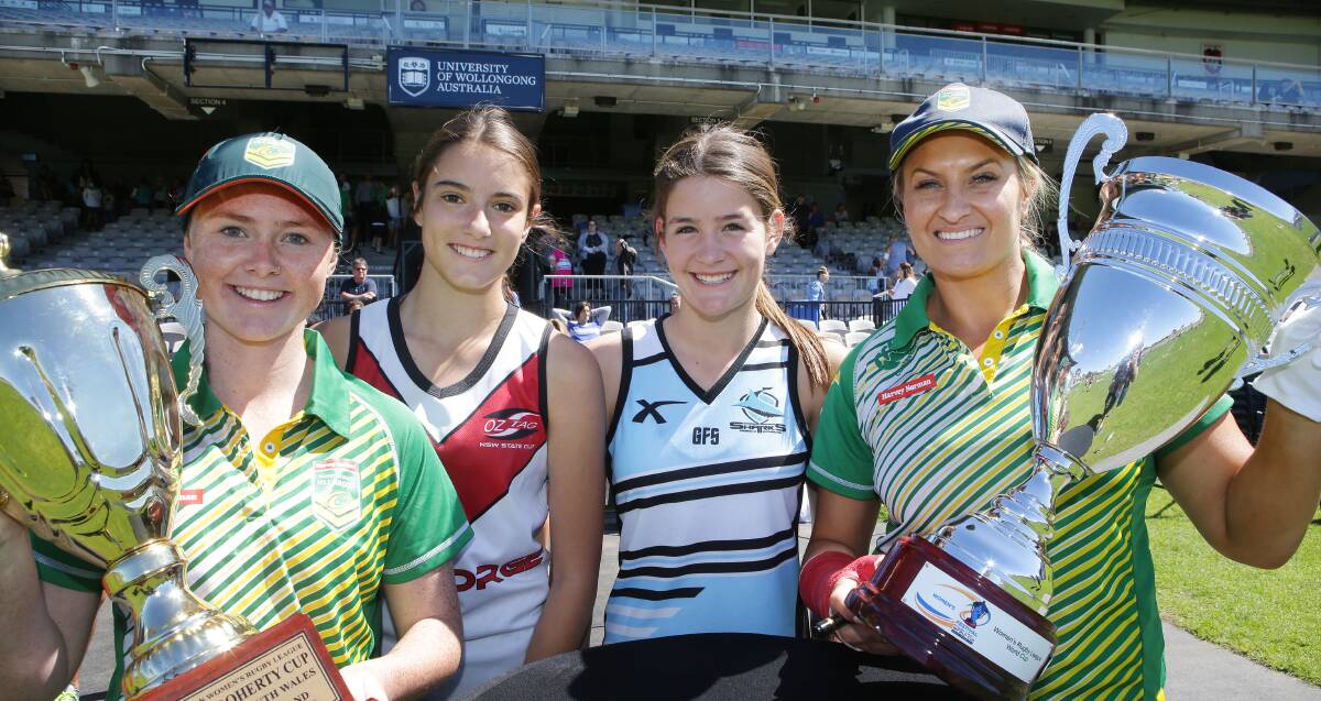 Present and future: Australian Jillaroos stars Maddie Studdon (left) and Ruan Sims (right) with two young players at Jubilee Oval, Kogarah. Picture: John Veage