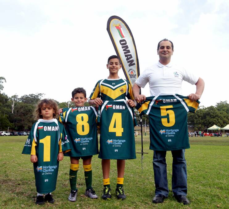 Grateful: Michael Ibrahim (right) with his sons Ali, Hussein and Tyson at Penshurst RSL's home ground at HV Evatt Park, Lugarno. The club recieved a generous sponsorship from the country of Oman. Picture: Chris Lane