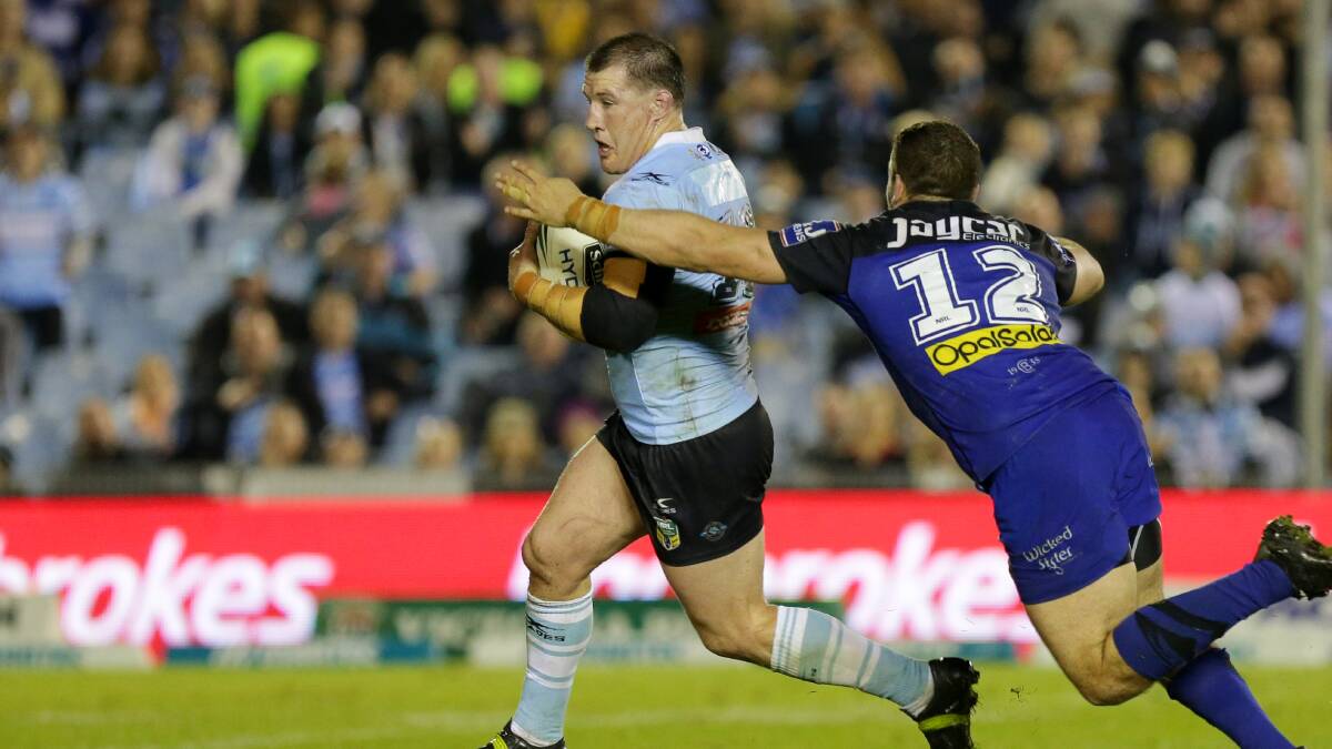 Unstoppable: Paul Gallen with his run that put Cronulla in position for the field goal on Saturday night. Picture: Chris Lane