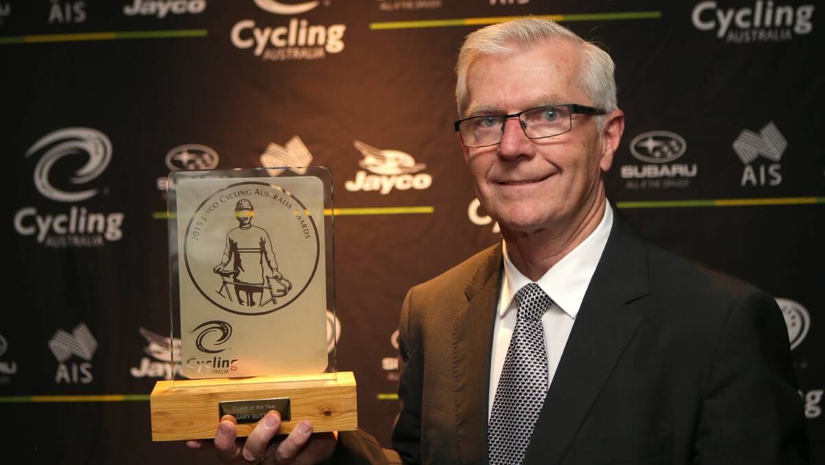 Gary Sutton is awarded his coach of the year accolade. Picture: John Veage