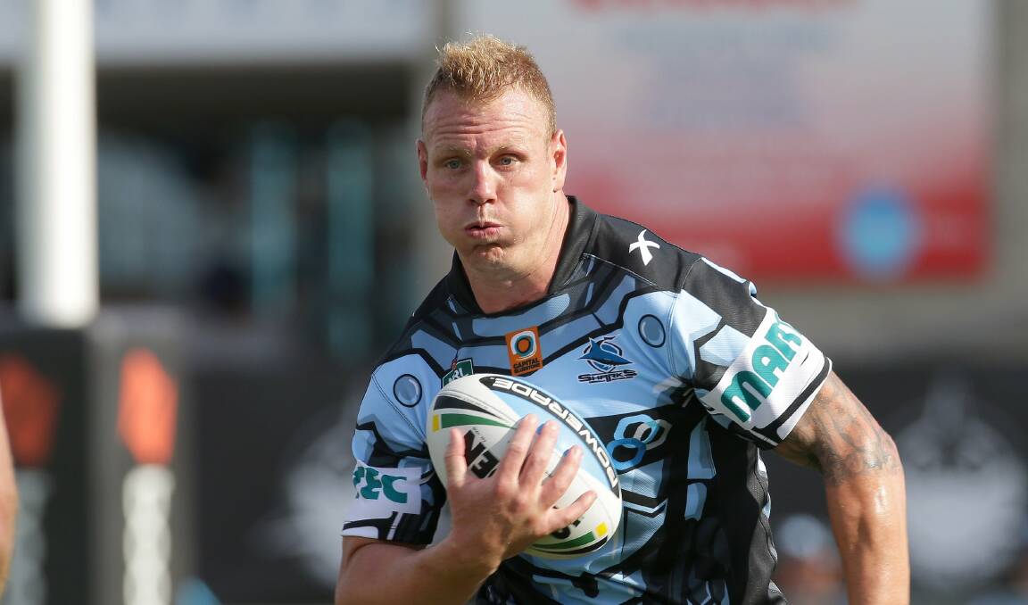 On the charge: Luke Lewis during pre-season against Manly. Picture: John Veage