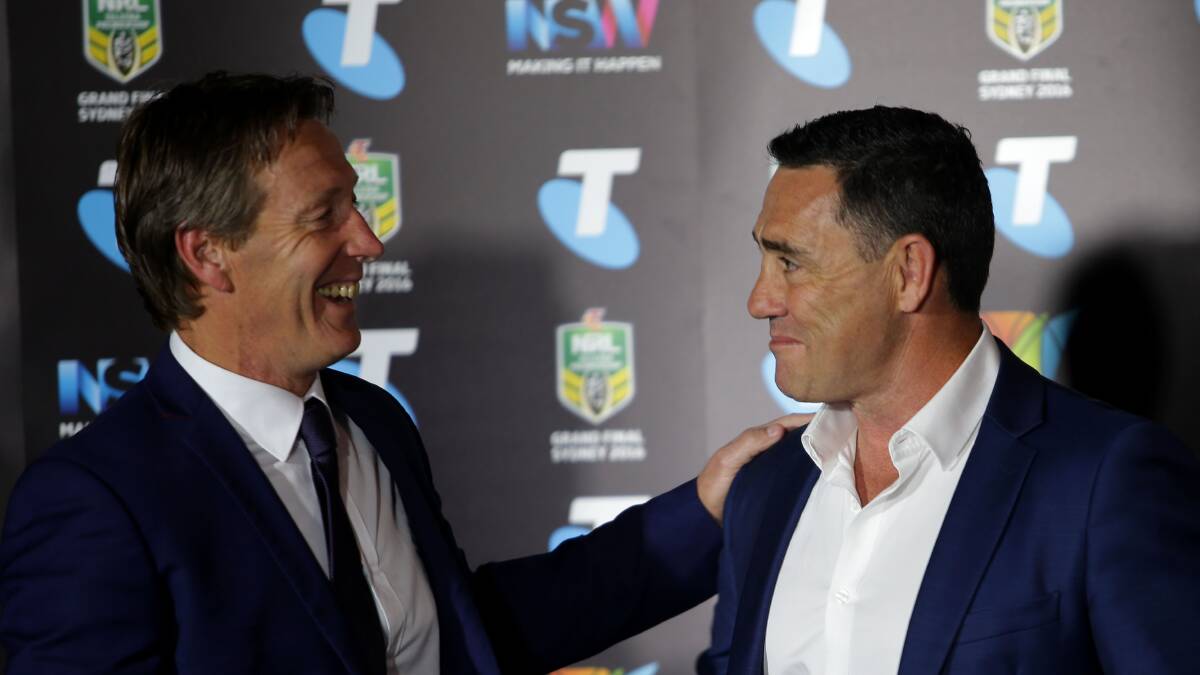 Face off: Storm coach Craig Bellamy (left) comes face to face with Cronulla coach Shane Flanagan at Thursday's grand final press conference. Picture: John Veage