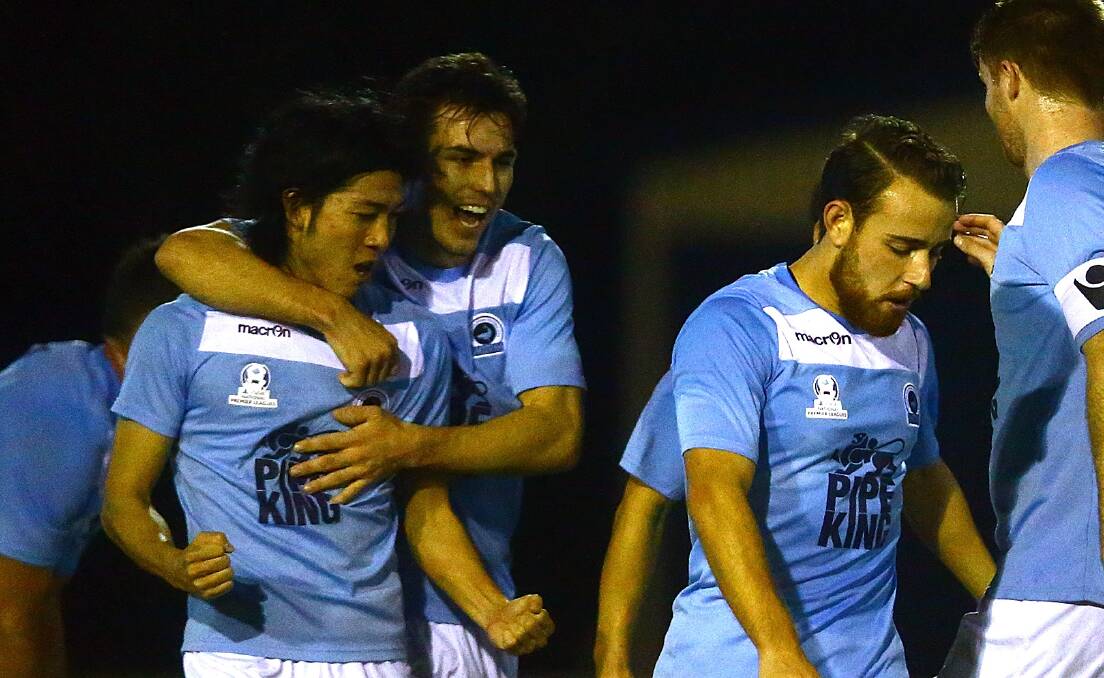 He's the man: Tomohiro Kajiyama is congratulated after scoring for Sutherland against Sydney United 58. Picture: Football NSW