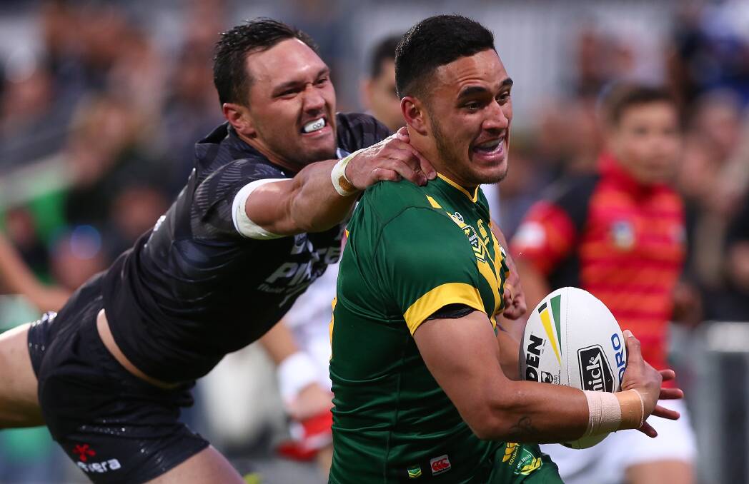 One to remember: Cronulla Sharks winger Valentine Holmes crosses for his first Test try during his debut for Australia on Saturday night. Picture: Getty Images