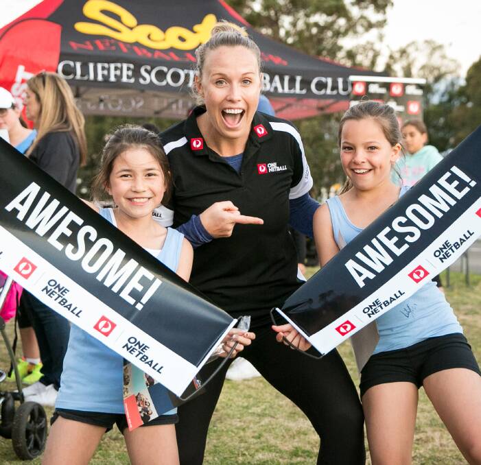 All smiles: Former Australian player Kim Green with Arncliffe Scots junior players. Arncliffe Scots won a sought-after community award for developing a program to help Muslim women and girls to participate. Picture: Narelle Spangher