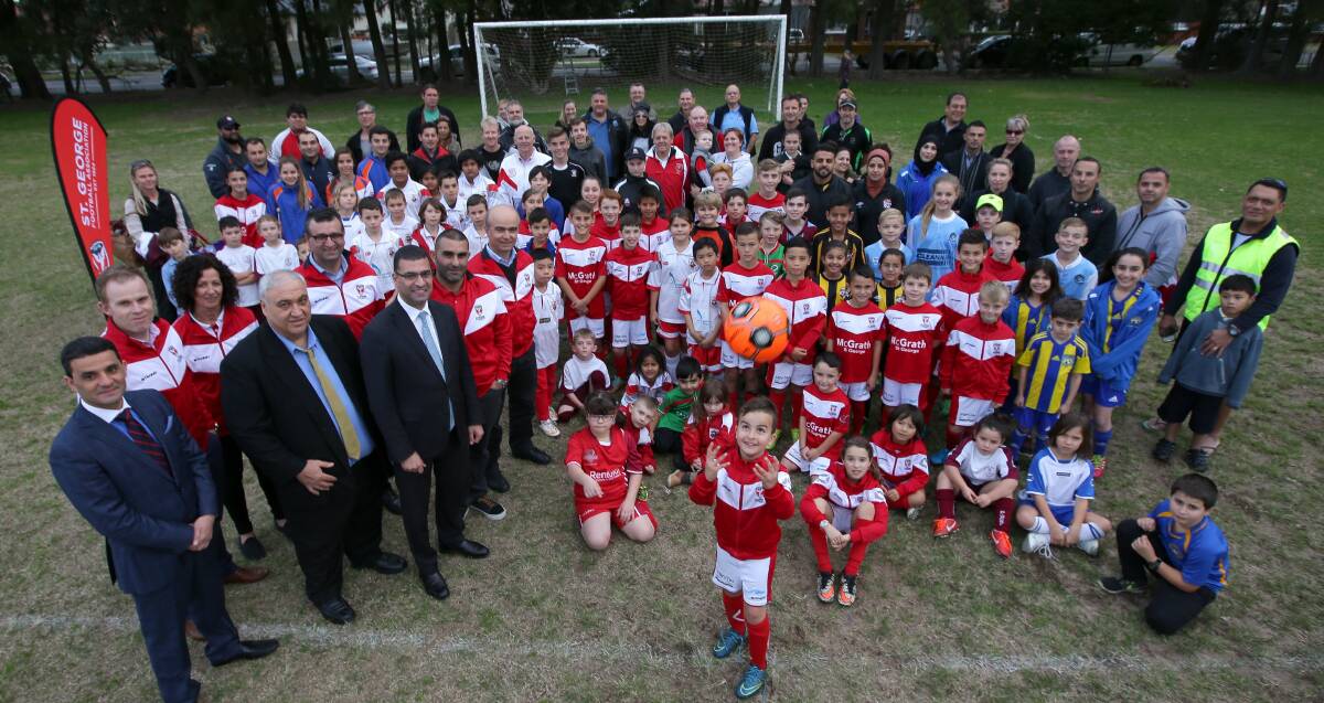 Home sweet home: St George Football Association players and officials with Barton MP Nick Varvaris at the announcement at J Graham Field last week. Picture: John Veage