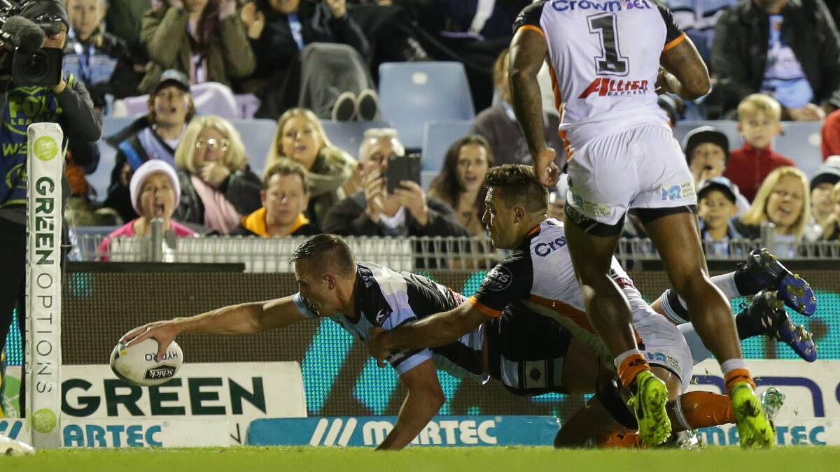 Off the mark: Cronulla Sharks centre Kurt Capewell scores his first NRL try against the Wests Tigers. Picture: Chris Lane