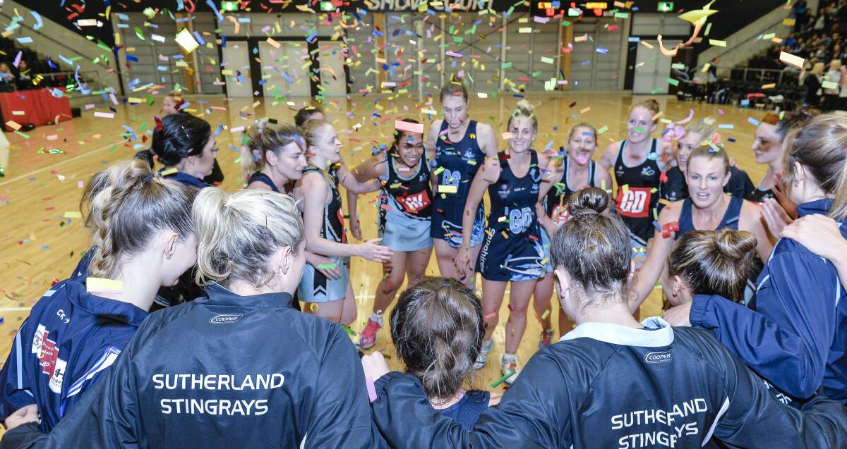 Champions: Sutherland Stingrays players celebrate winning the inaugural Netball NSW Premier League title against Manly Warringah last week. Picture: Nigel Owen