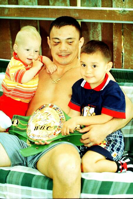 Growing up: Nikita (left) and Tim (right) with dad Kostya Tszyu in August 1999 after he won the vacant WBC title over Miguel Angel Gonzalez. Picture: John Veage