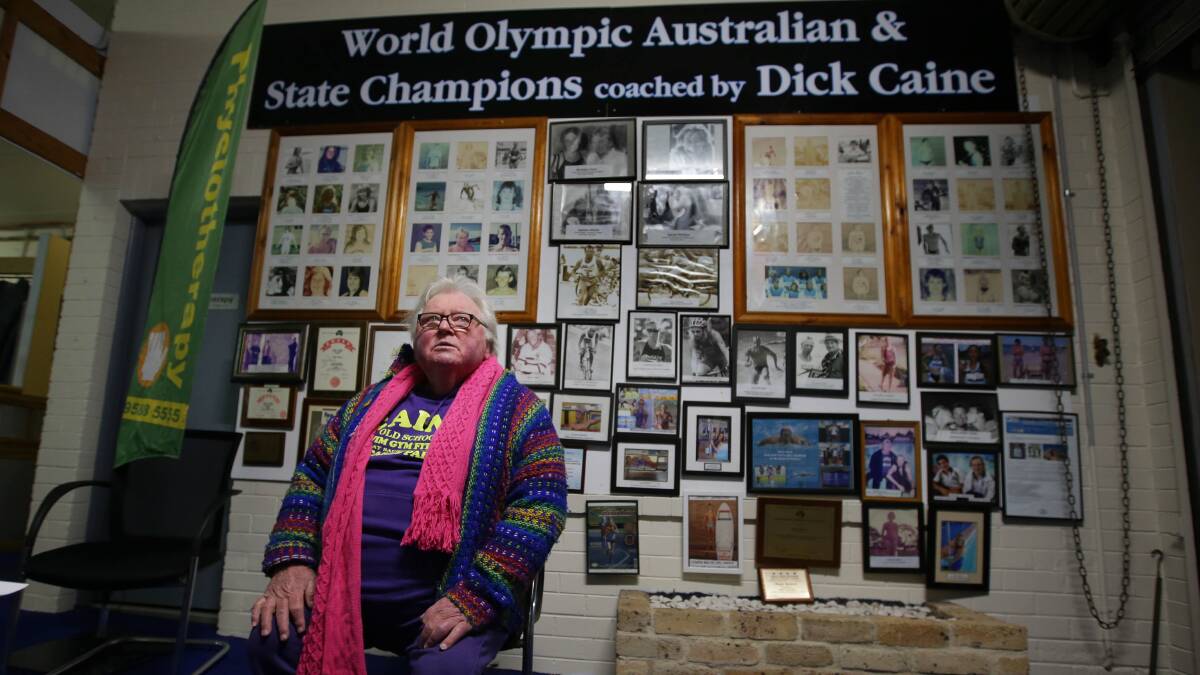 Coach without peer: St George and Sutherland Shire coaching icon Dick Caine in front of his wall of champions at Carss Park Memorial Pool. Picture: John Veage