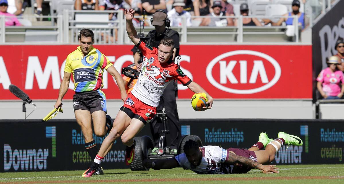 You can't catch me: Dragons flyer Jai Field evades Jorge Taufua to score. Picture: Grant Trouville/NRL Photos