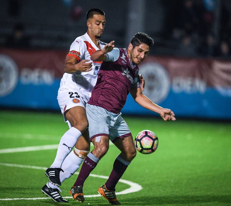 Bad night out: Rockdale City striker Jordan Figon attempts to win the ball back for the Suns against APIA Leichhardt. Picture: Football NSW