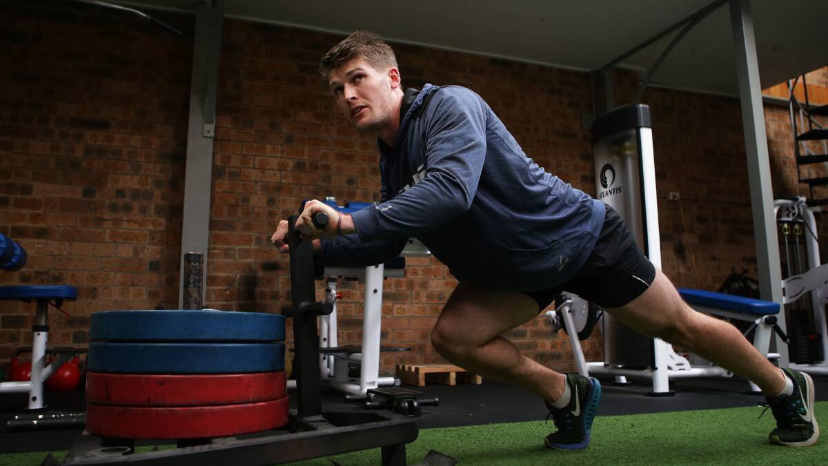 Hayden Smith training back home in the gym. Picture: John Veage