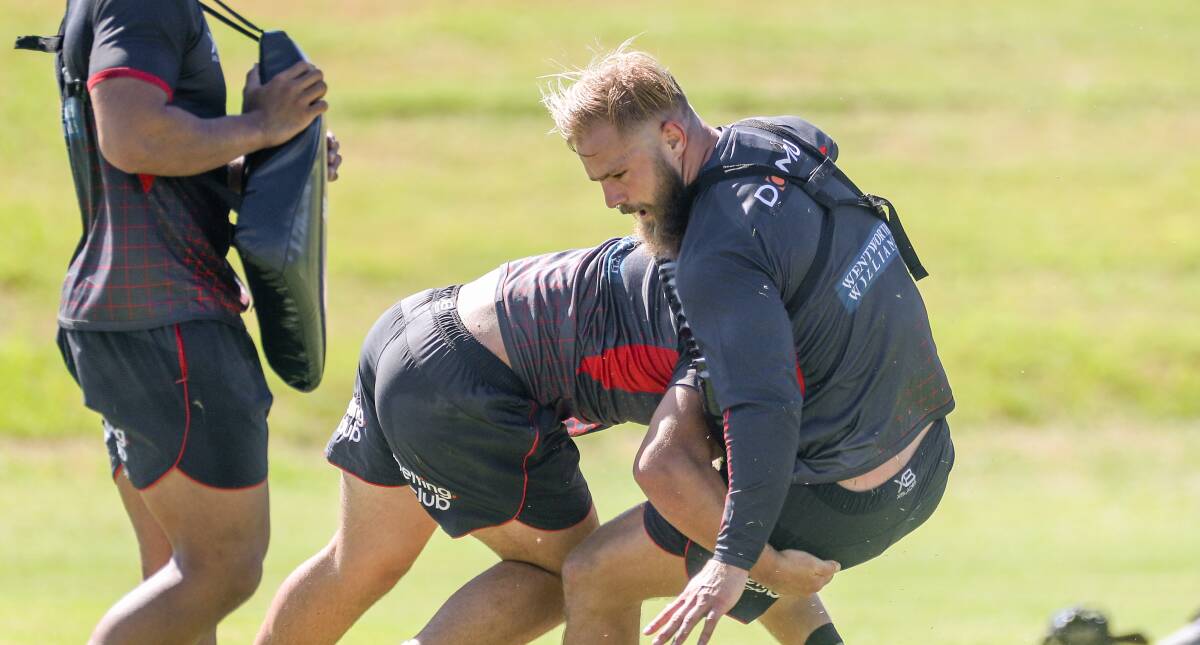 Jack de Belin is tackled at Dragons training on Thursday. Picture: Adam McLean