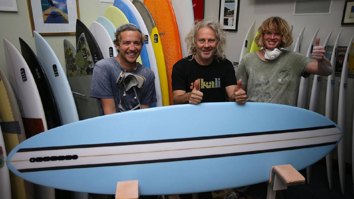 Black, white and blue through and through: PCC Surfboards owner and creator Stuart Paterson (centre) with Jake Bevan and Rielly Clarke. Picture: John Veage
